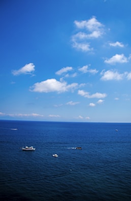 A panoramic view from the boat showing the vast Mediterranean Sea under a bright blue sky.