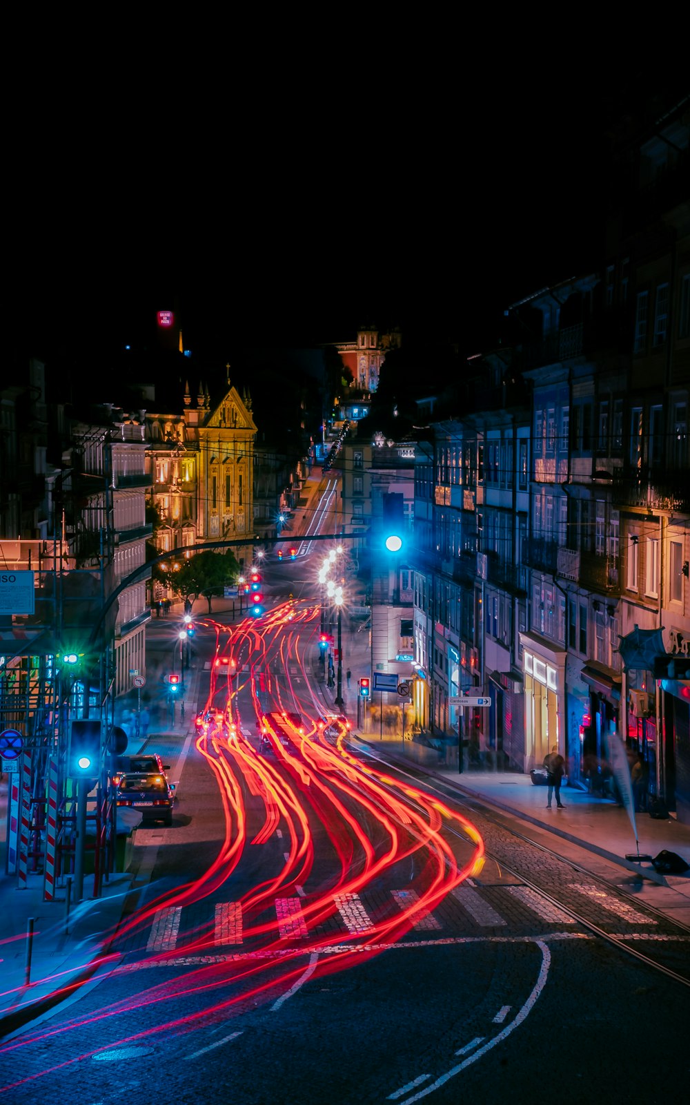 lighted cars in street at night