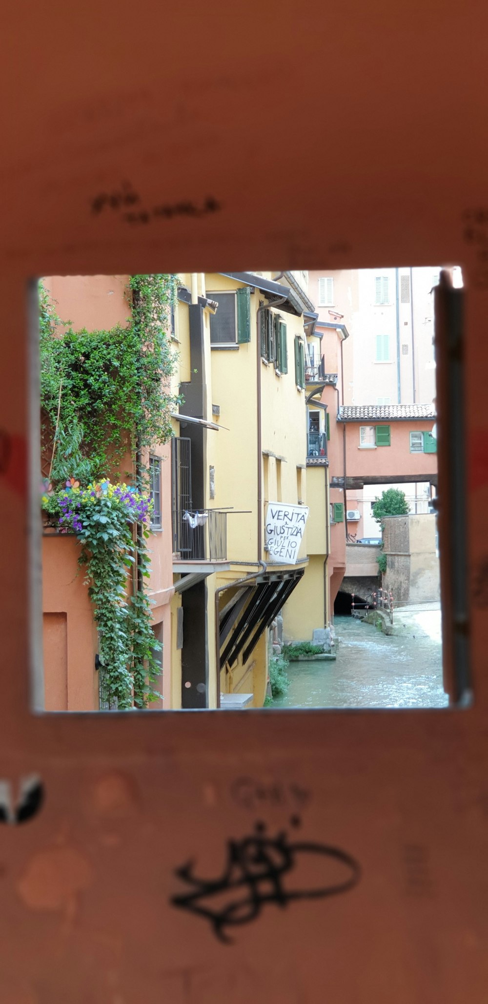 yellow and brown houses seen through window