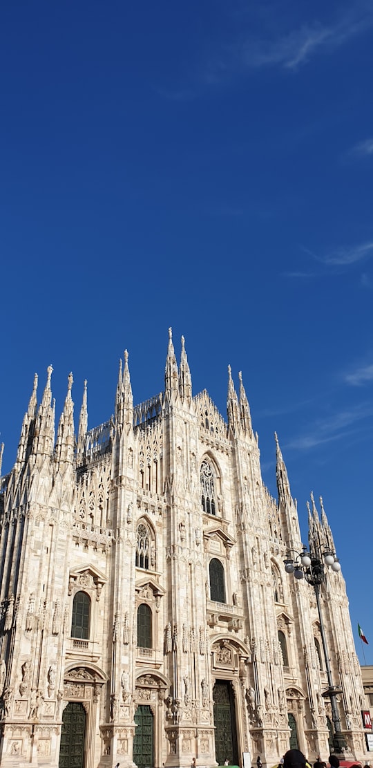 beige cathedral building in Duomo di Milano Italy