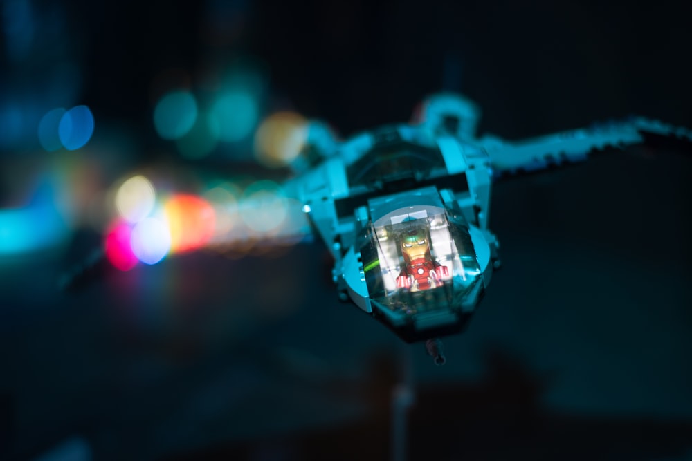 a close up of a camera with blurry lights in the background