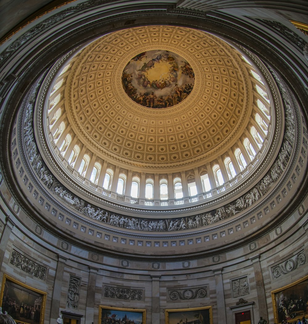 gray and brown dome building interior ]