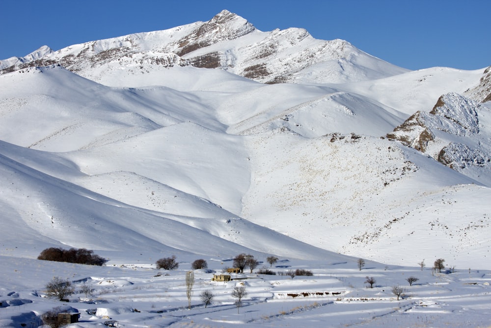 cabin house at snow covered valley