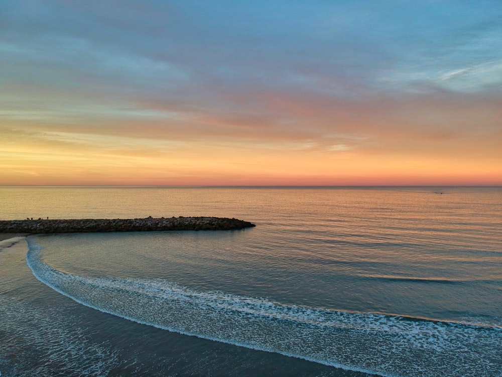 golden hour photography of body of water