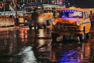 yellow vehicle traveling on road