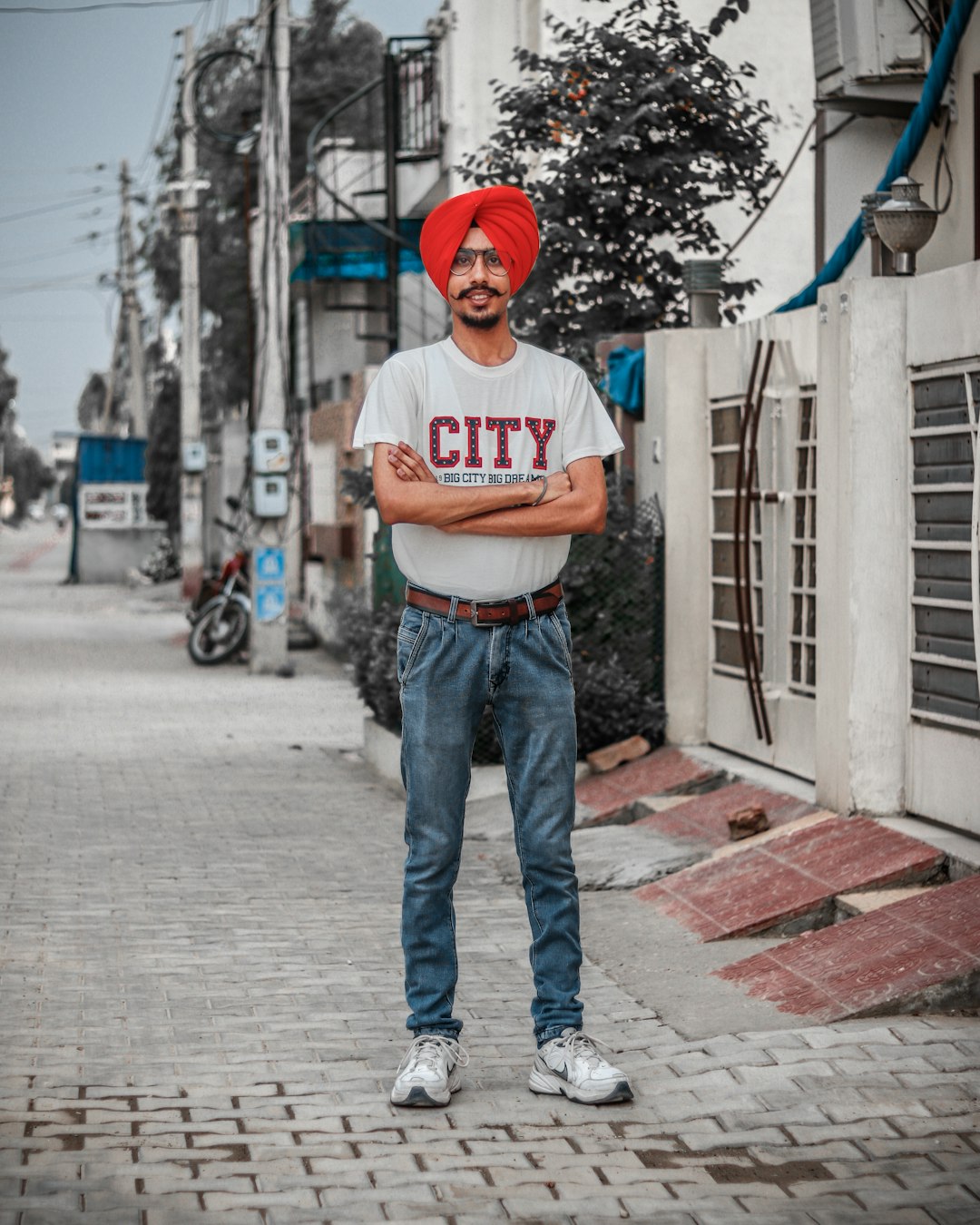 man standing on sidewalk