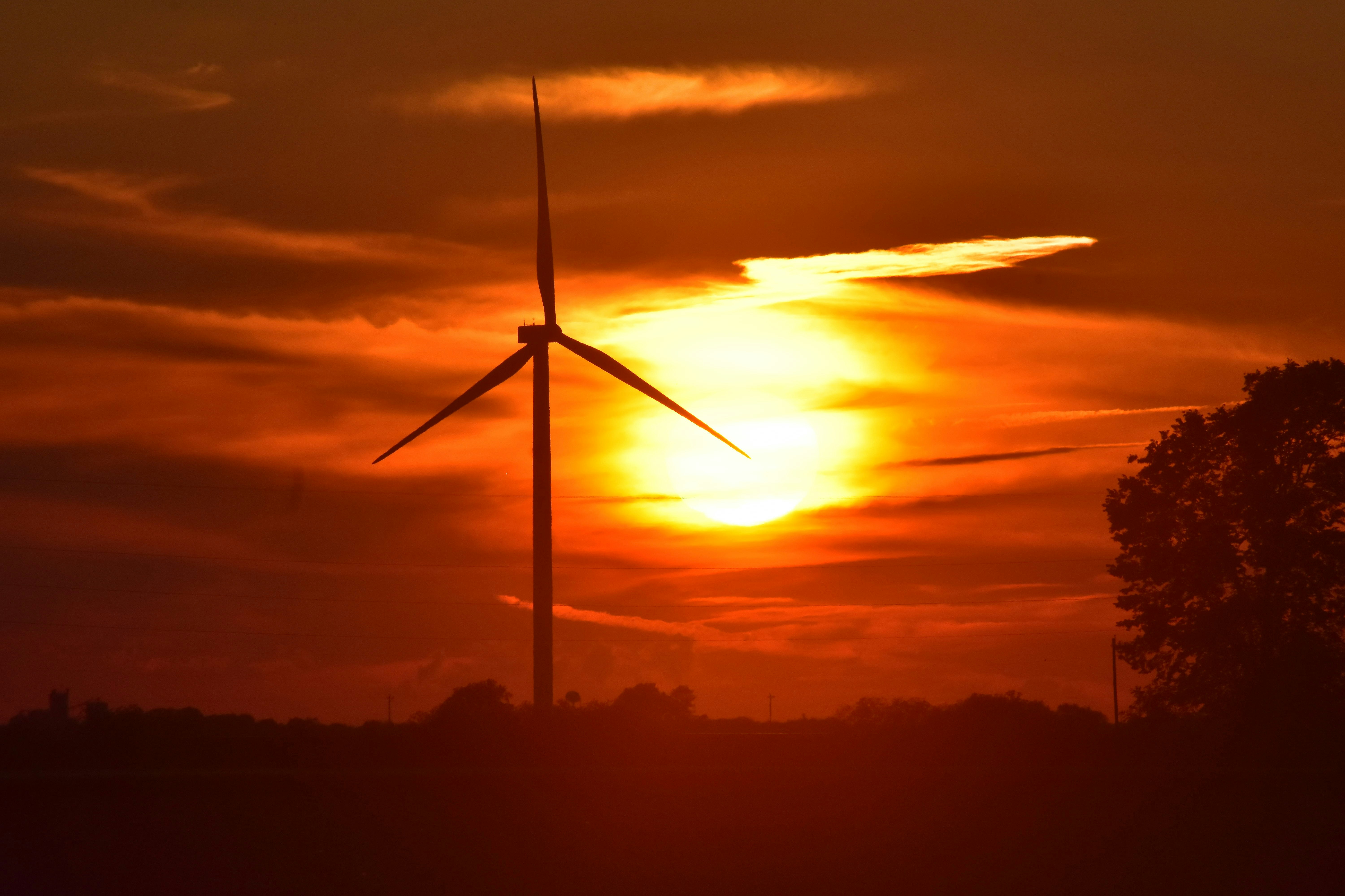 Silhouette Of Windmill Under Crimson Sky At Sunset Photo Free Nature Image On Unsplash