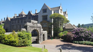 A welcoming entrance of a prestigious UK independent boarding school on a sunny day.