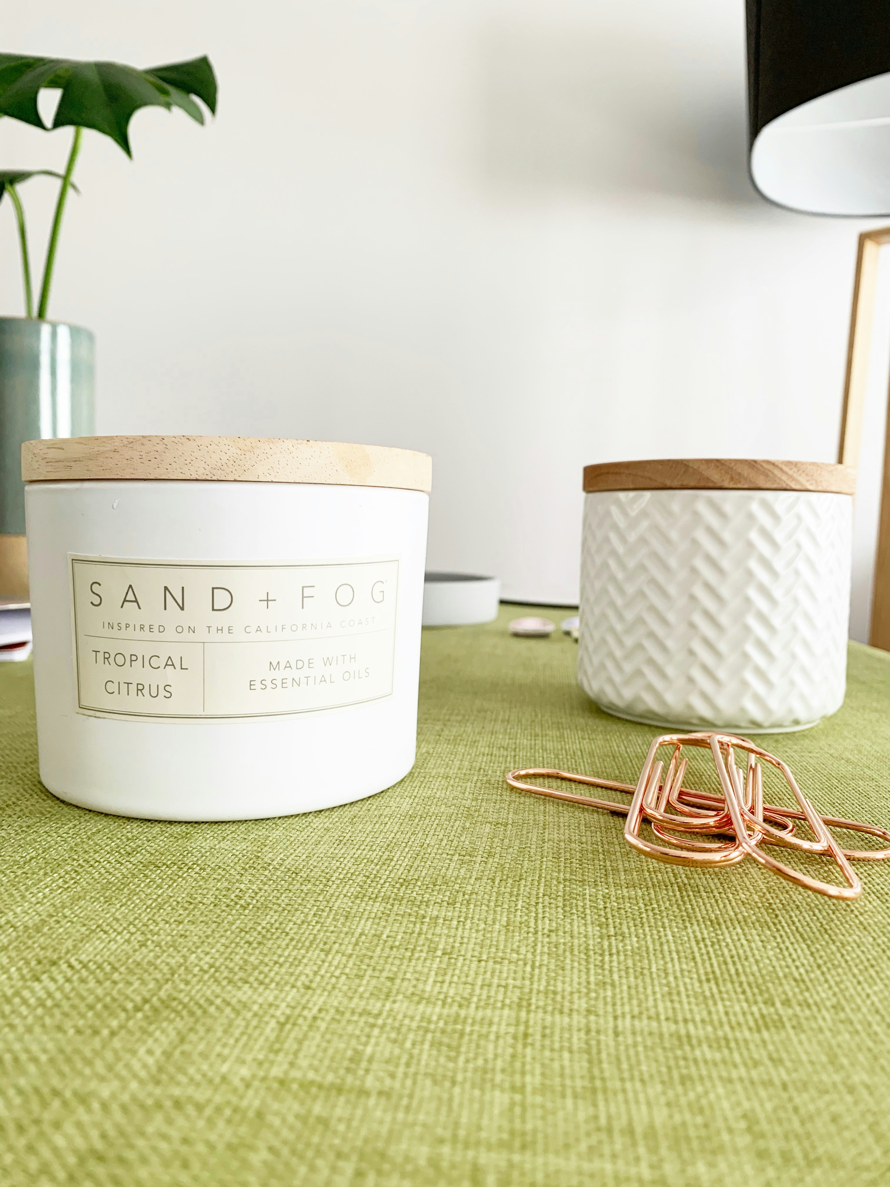 two white and brown jars