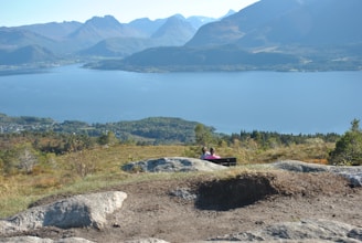 A scenic view of a travel destination with a couple enjoying the landscape.