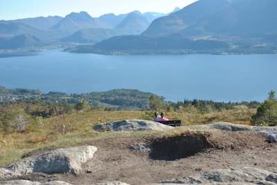 A scenic view of a travel destination with a couple enjoying the landscape.