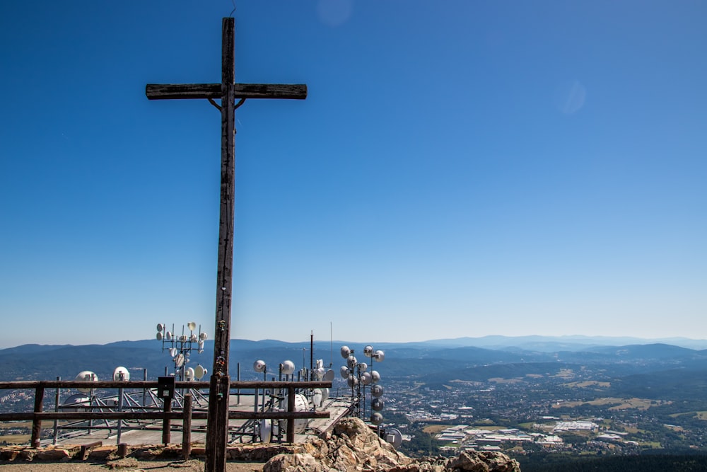 crucifix on hill during daytime