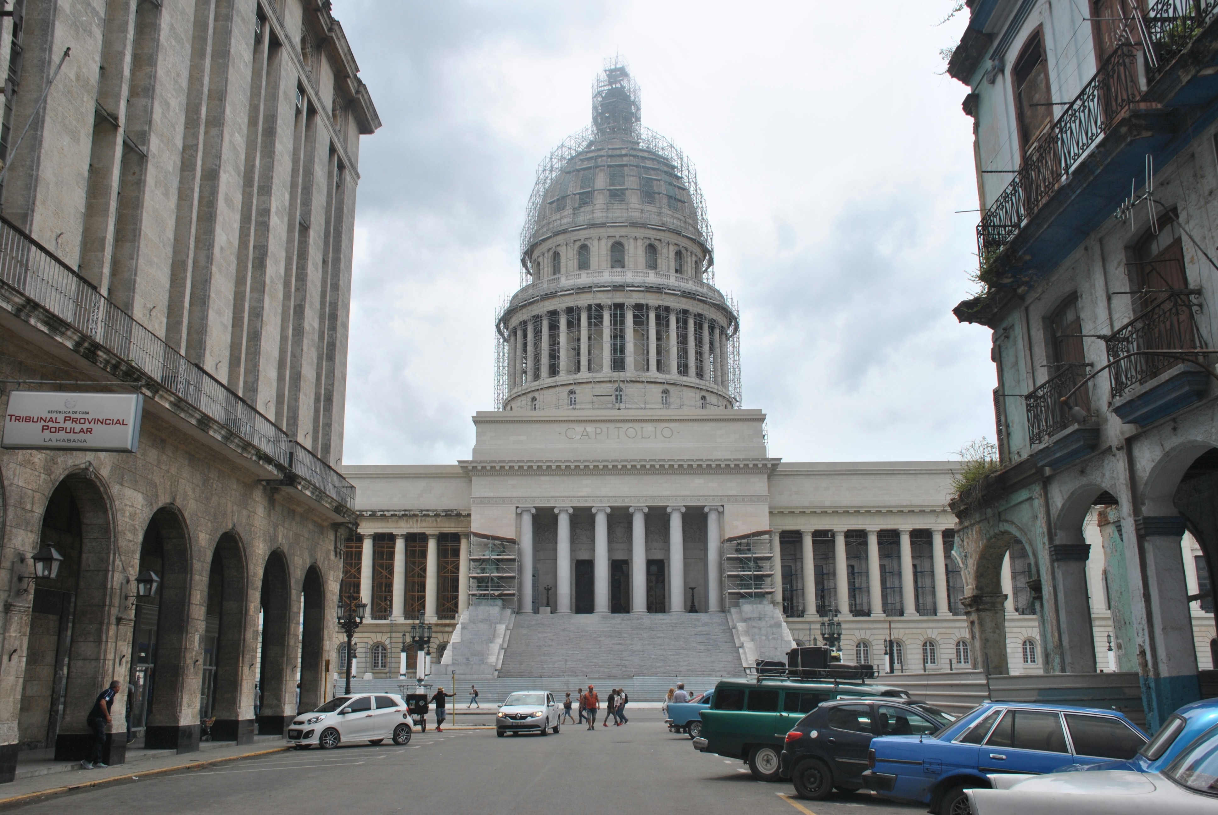 vehicles parked near white dome buildings