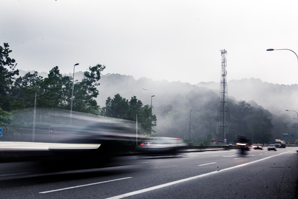 cars on road during foggy weather