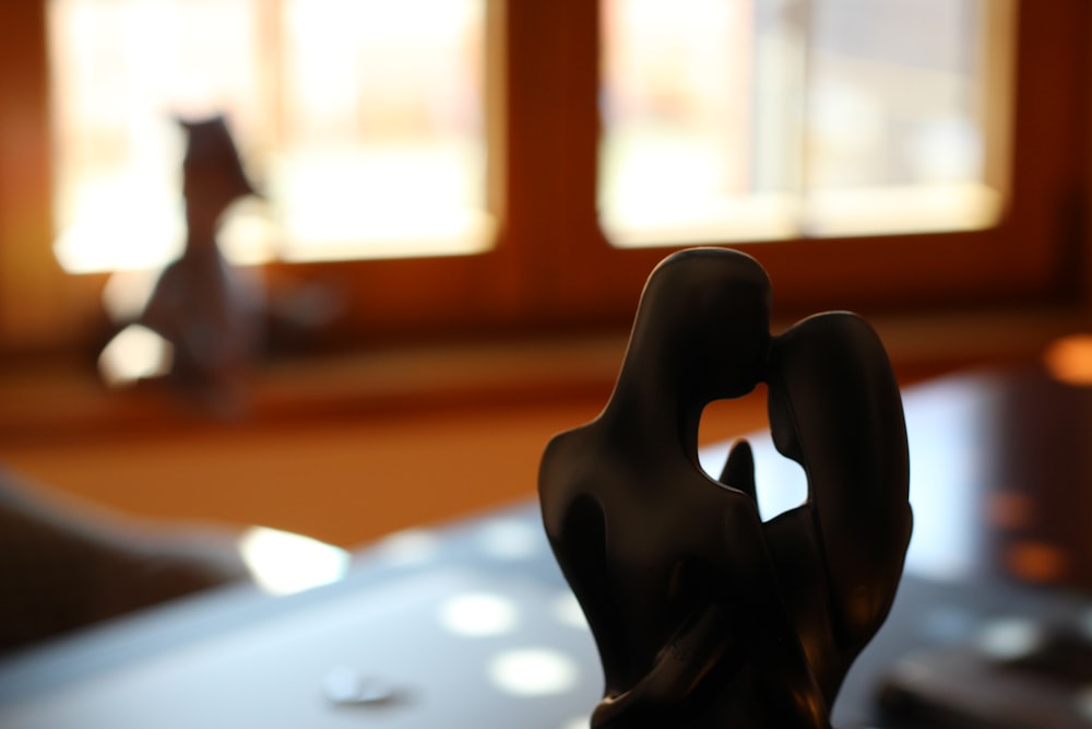 couple statuette on desk