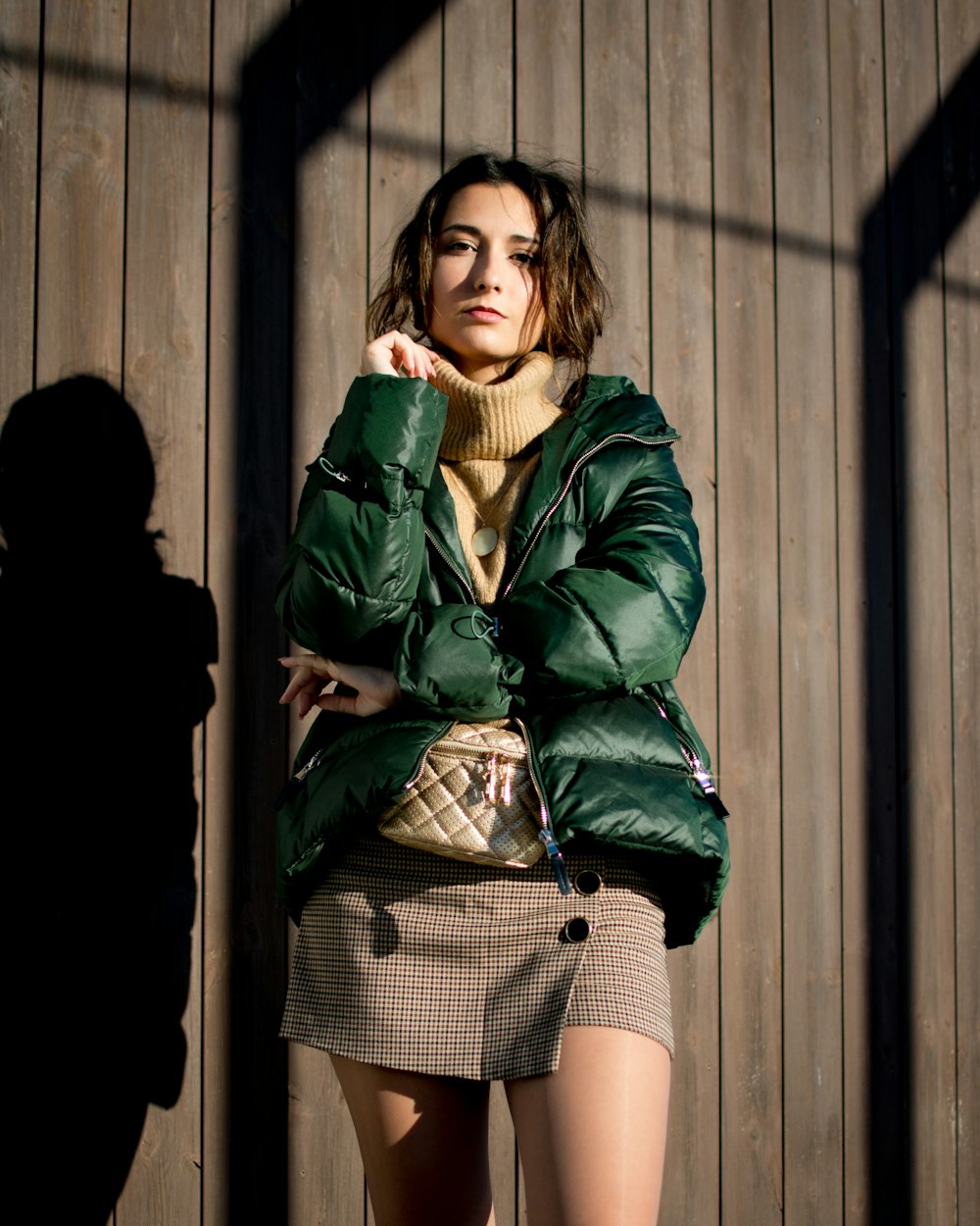 woman standing beside wall