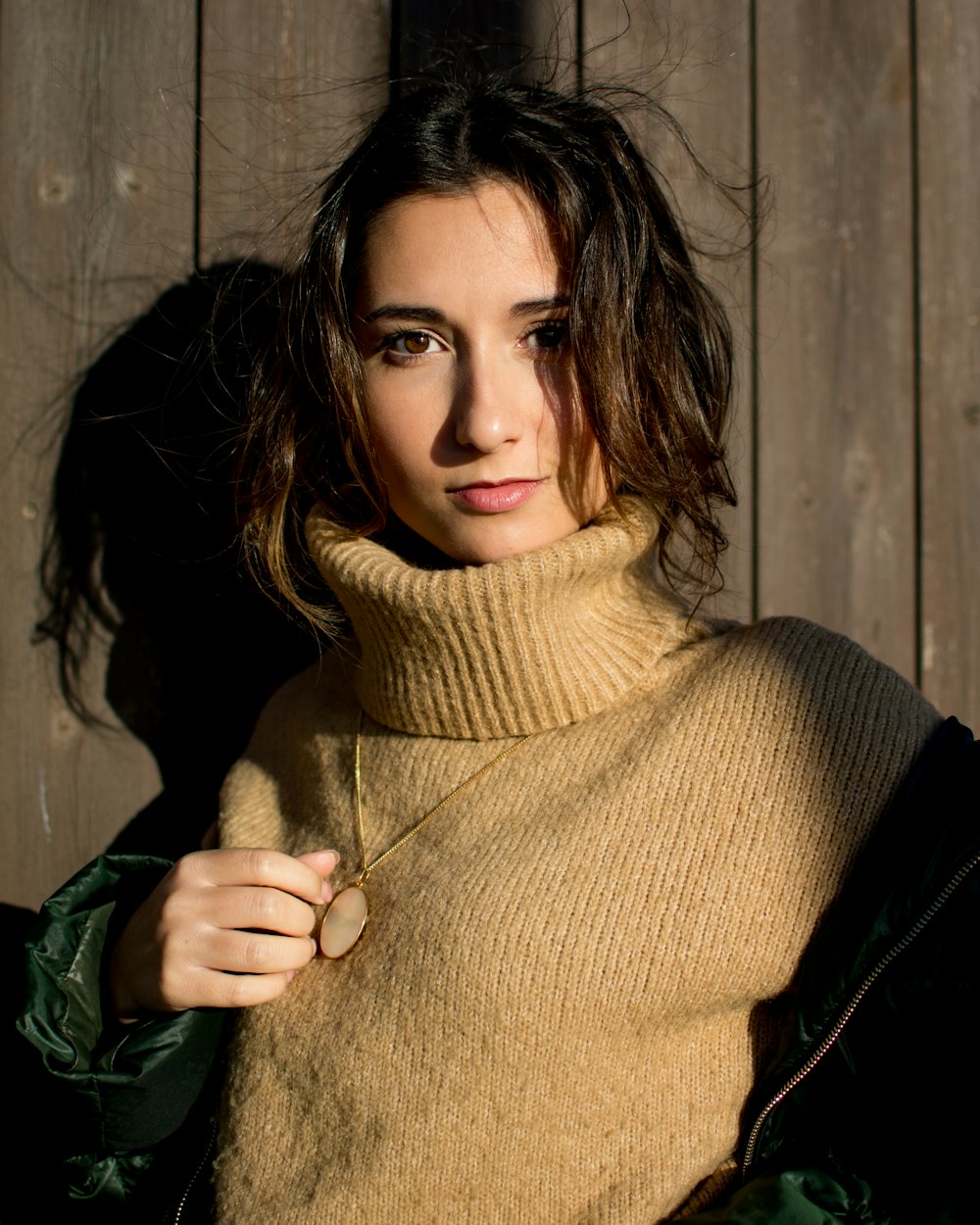 woman leaning on wall