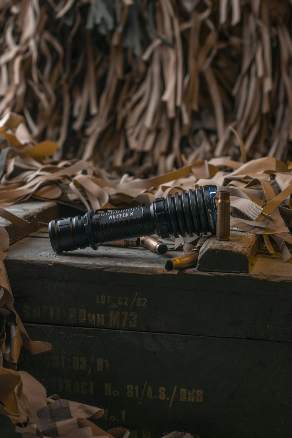 black scope on brown wooden box