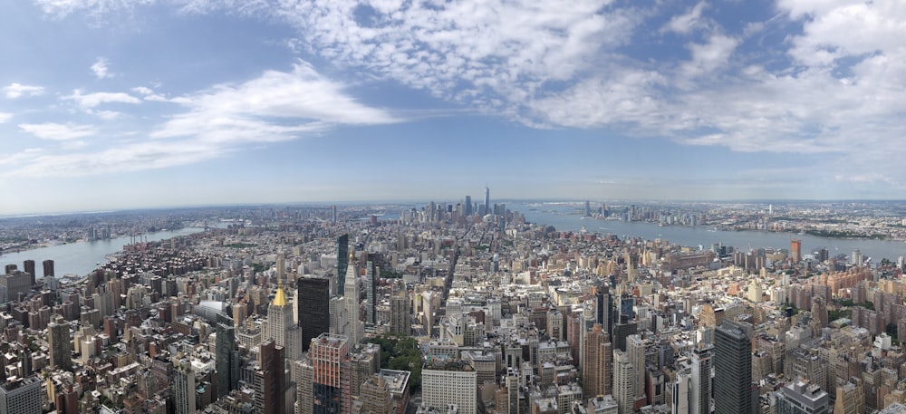 brown concrete buildings under white clouds