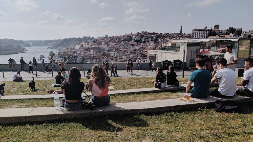 group of people sitting on ground