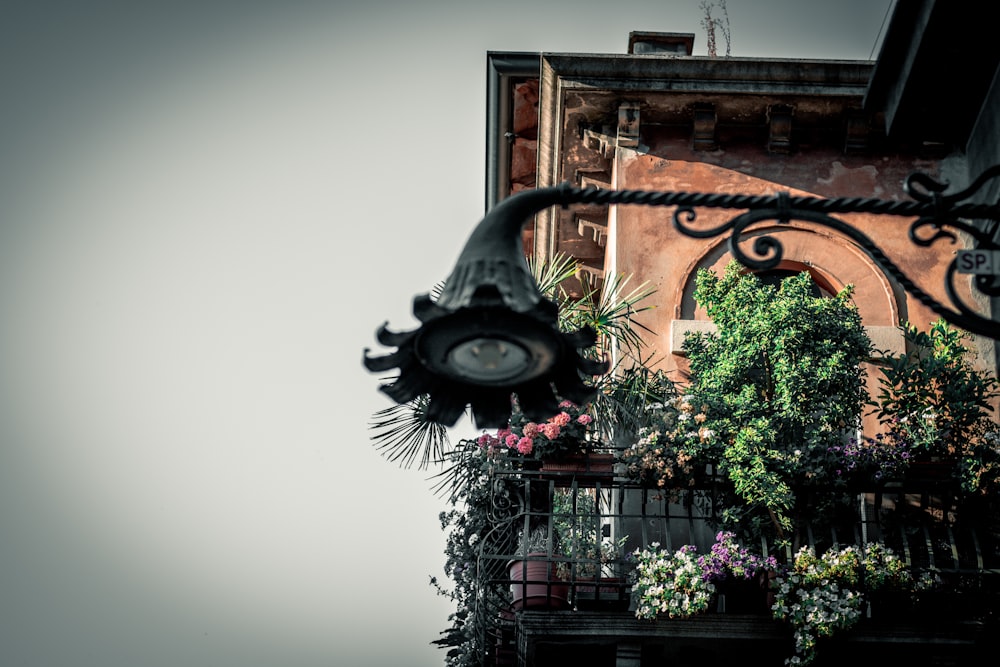 turned-off light post with balcony view