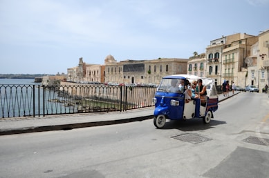 people riding auto rickshaw