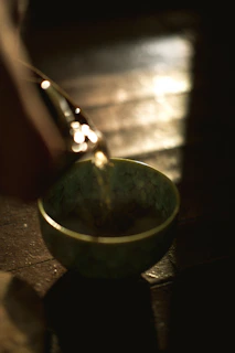 water pouring on blue round bowl