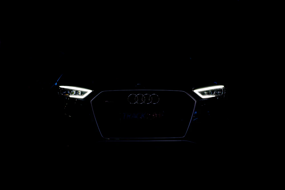 Audi grille and headlights glowing in the dark