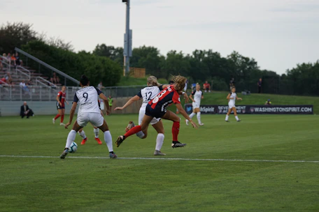 A lively soccer match featuring the Rías Baixas women's team in action.