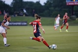 A football player in motion during a match.