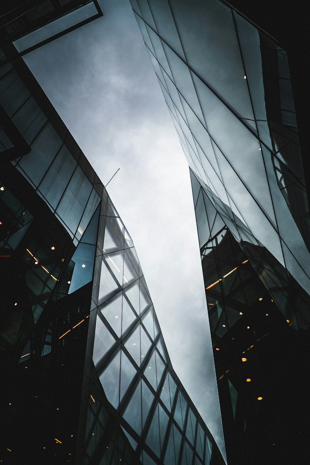 low angle photo of curtain glass wall building