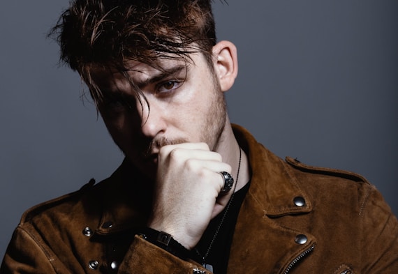 man wearing brown jacket