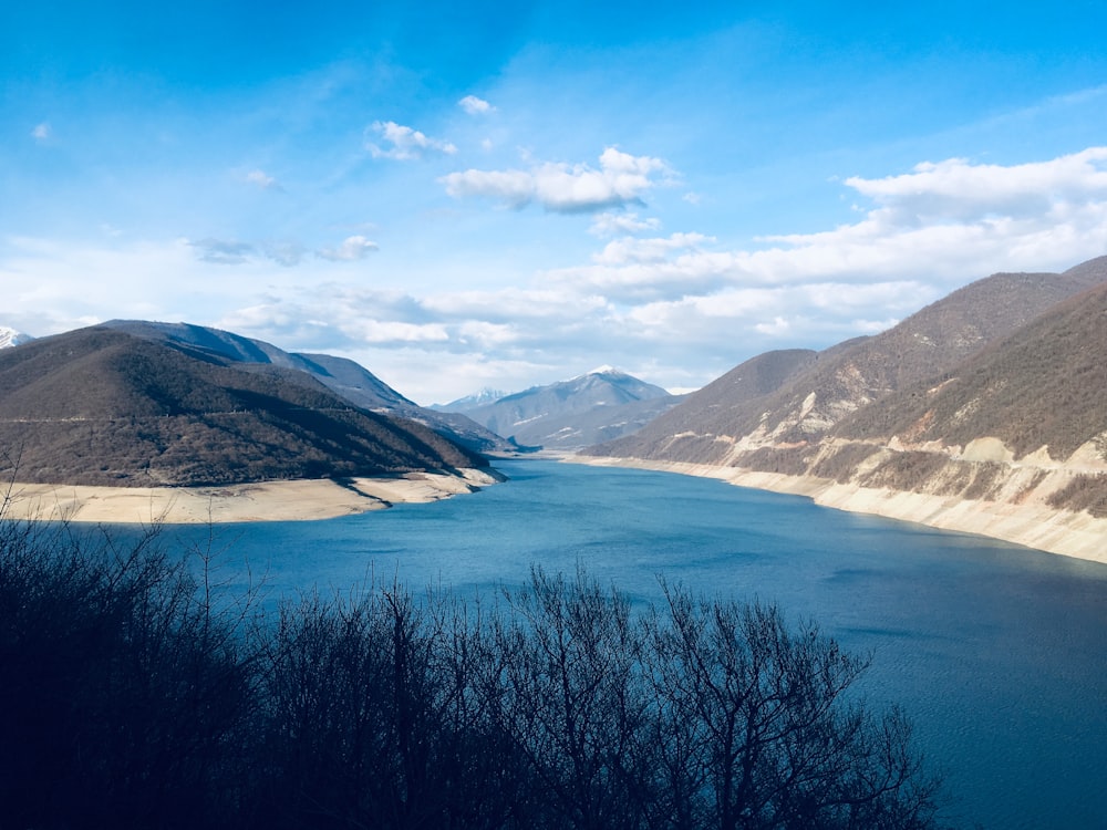 body of water near mountain range