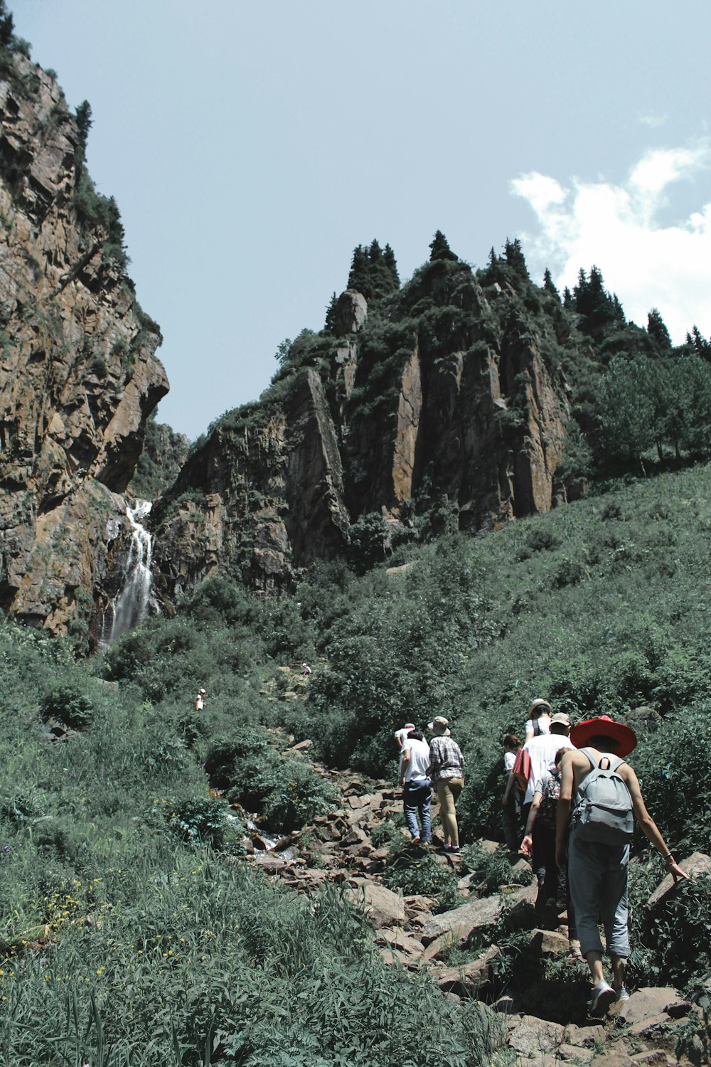 people walking on gray mountain during daytime