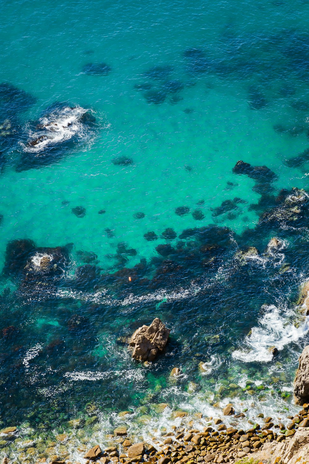 a body of water surrounded by rocks and rocks