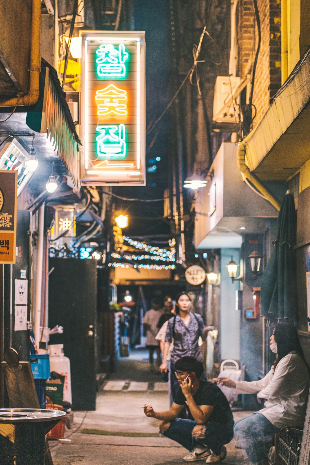 people along alleyway