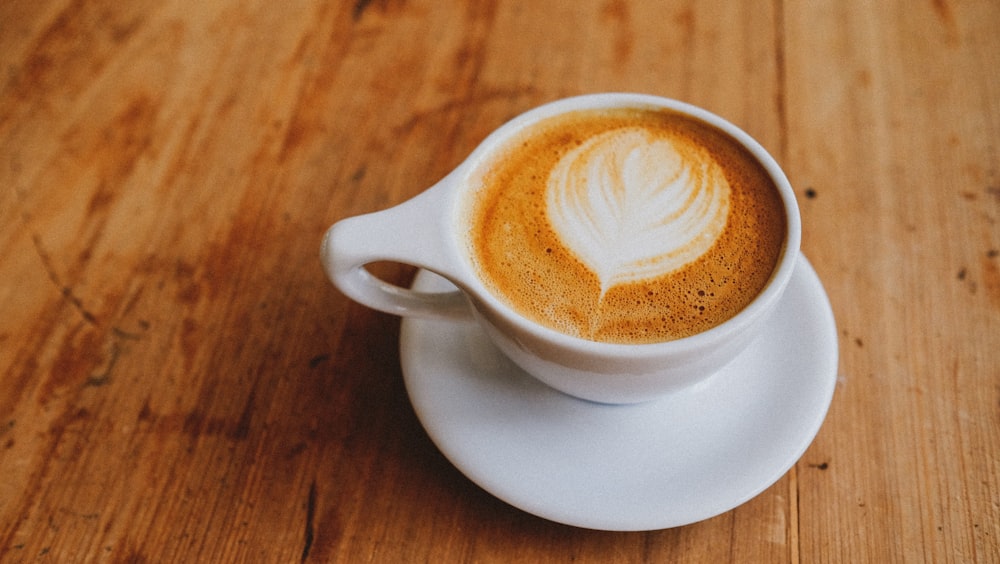 white ceramic cup with coffee