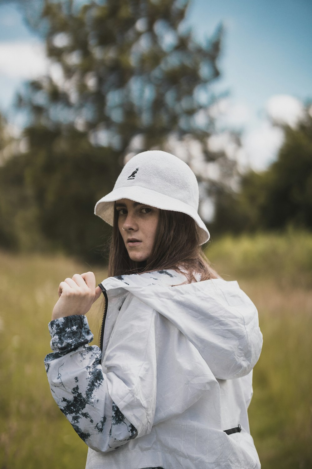 woman wearing white cap