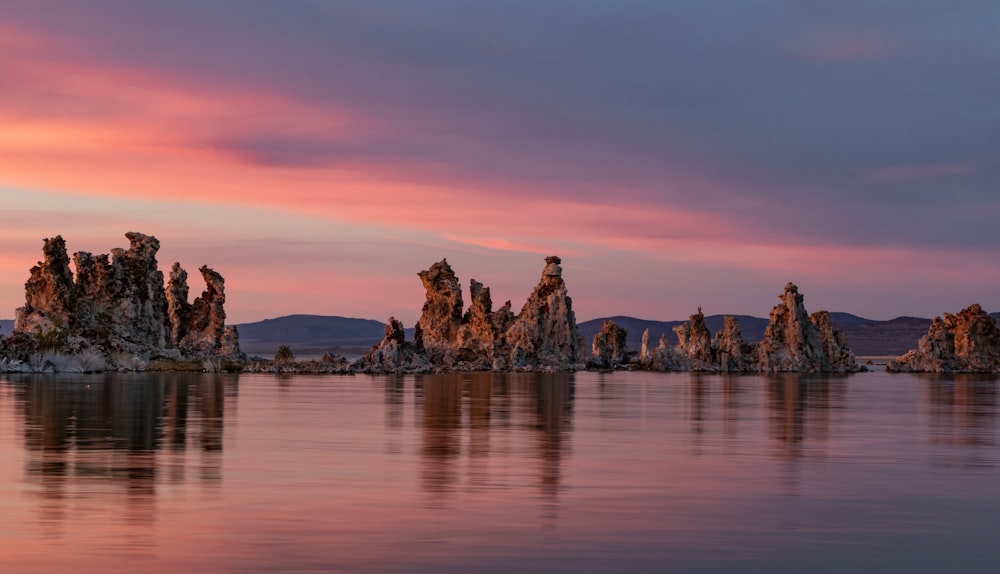 body of water near stones