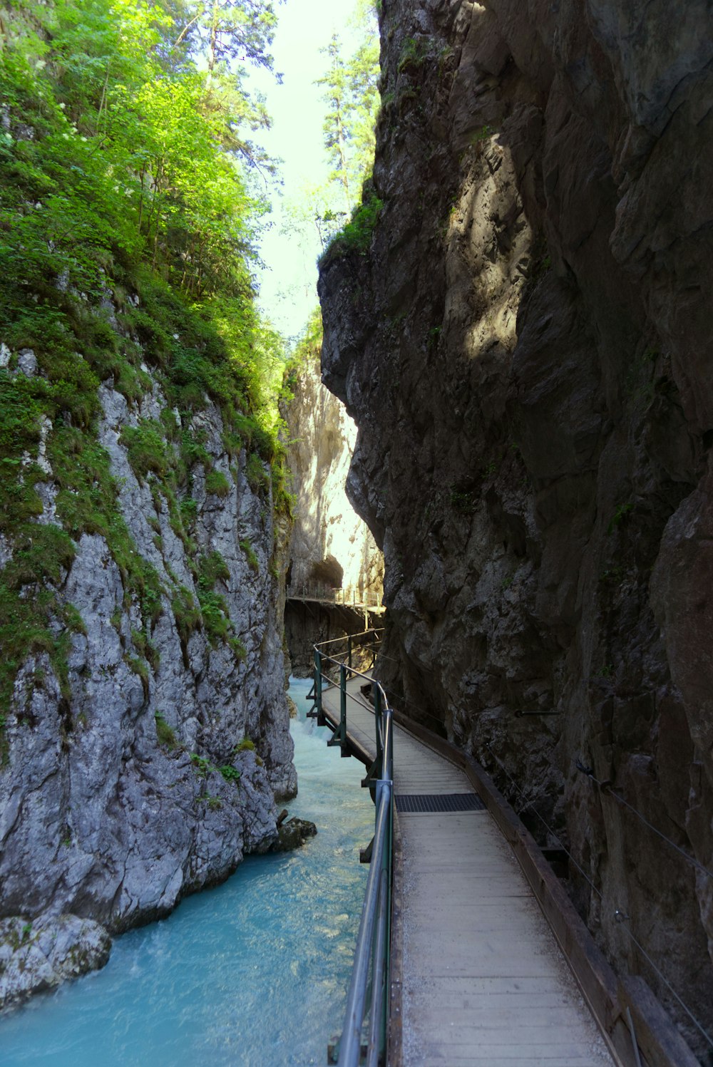 pathway in rock formation during daytime