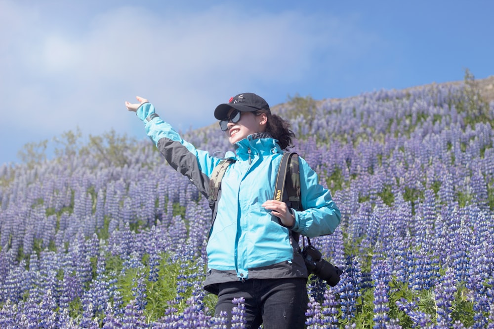 unknown person standing on lavender flower field