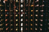 assorted wine bottle on racks