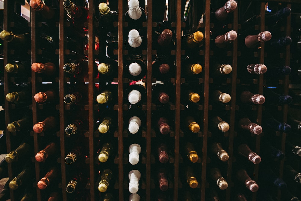 assorted wine bottle on racks