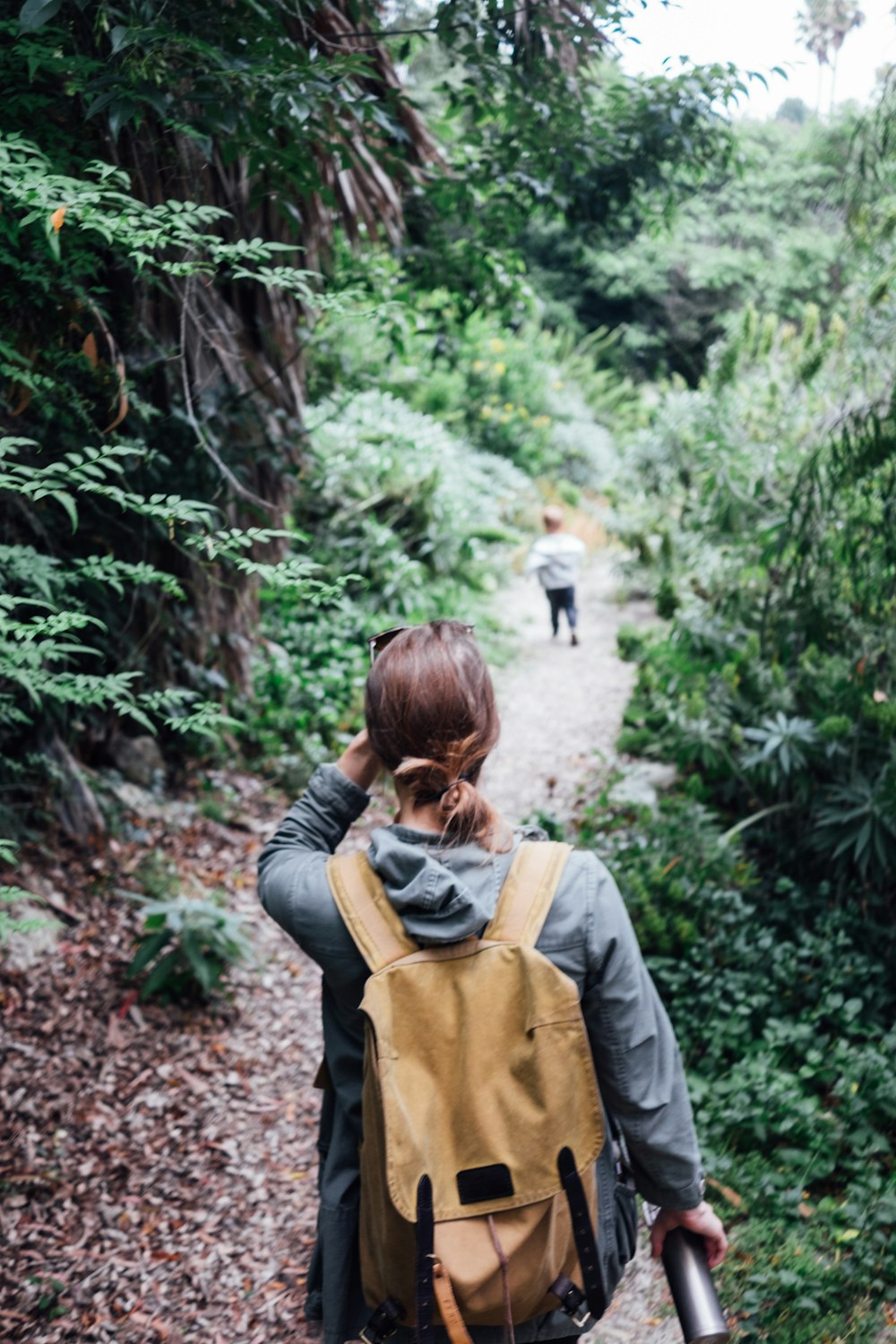 woman wearing yellow backpack