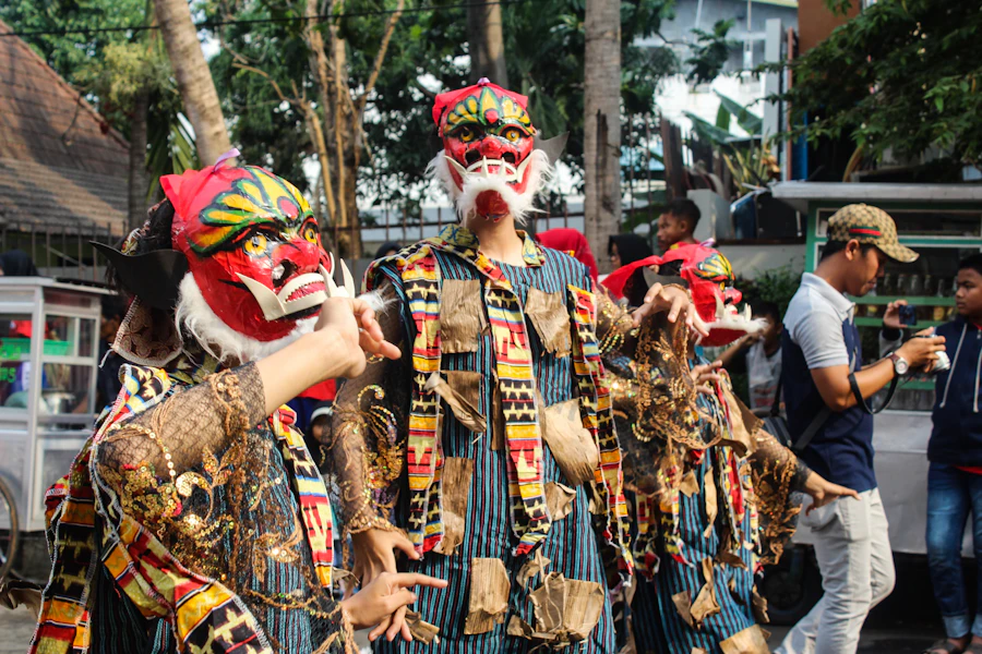 Traditional Balinese legong dancers performing in ceremonial costume at dusk