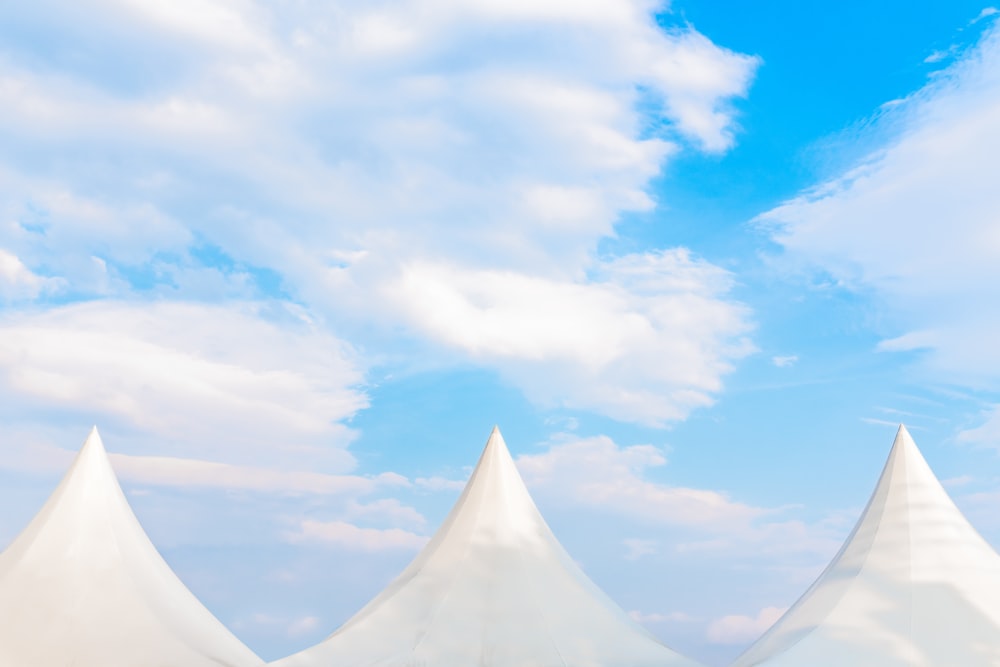 white canopy tent near clouds