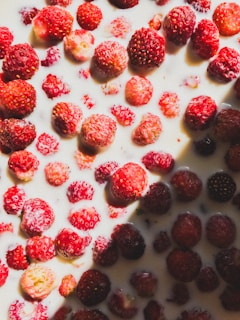 Bright red strawberry pulp with fresh strawberries around