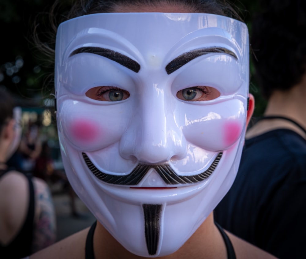 person wearing guy fawkes mask