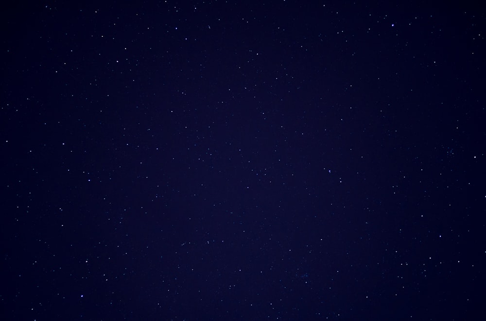 a night sky with a few stars in it