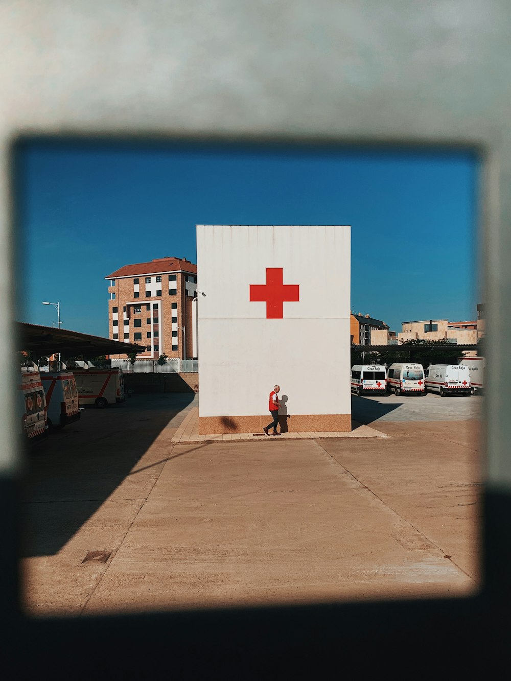 white and red cross logo